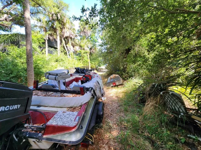 view from structure to gate on Ginger Rd.  Owner plans to remove boat, trailer and van. Be respectful of owners belongings.