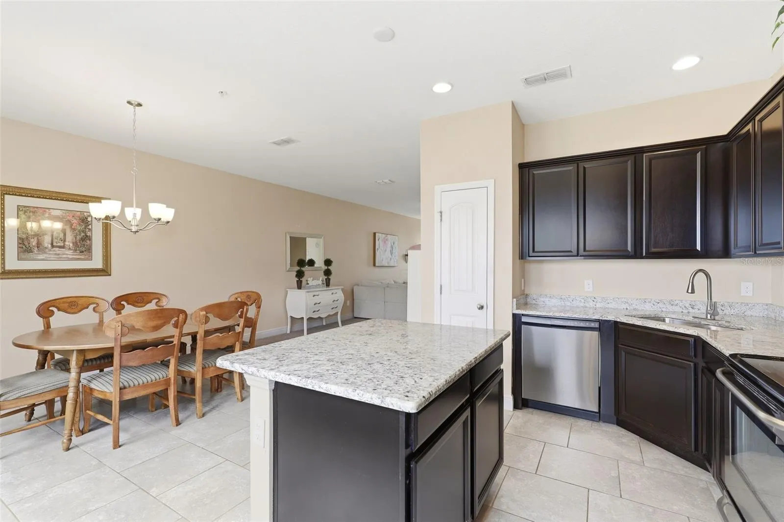Open concept kitchen with island overlooking the dining area
