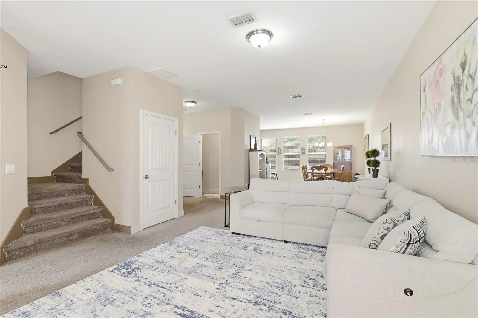 family room and stairs leading to third floor bedrooms