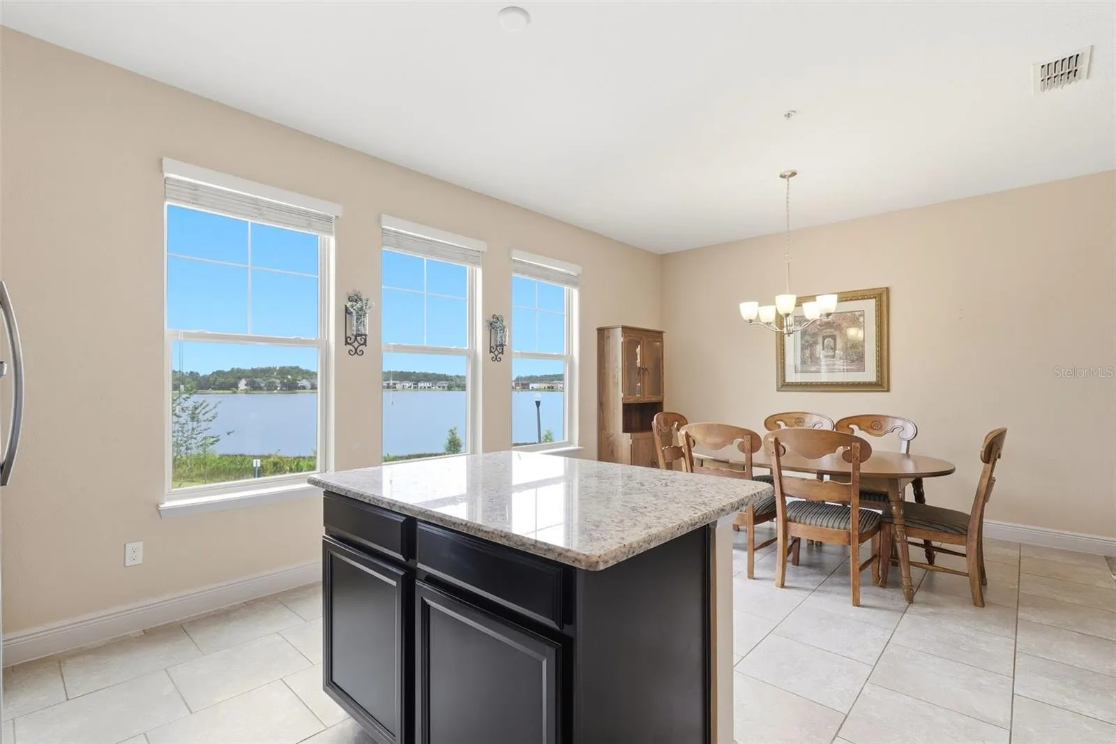 Open concept kitchen with island overlooking the dining area