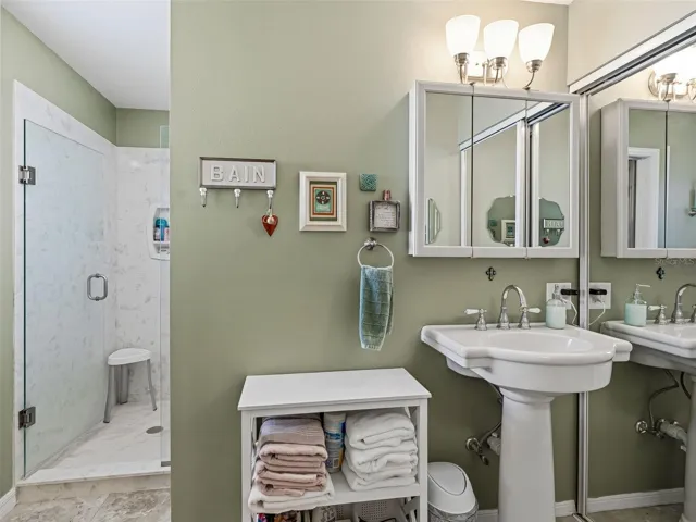 RENOVATED BATH WITH NEWER SHOWER AND PEDESTIAL SINK