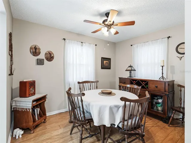 FORMAL DINING ROOM AREA WITH LUXURY FLOORING