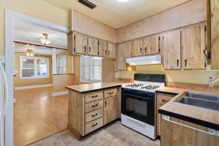 KITCHEN LOOKING INTO DINING ROOM AND LIVING ROOM