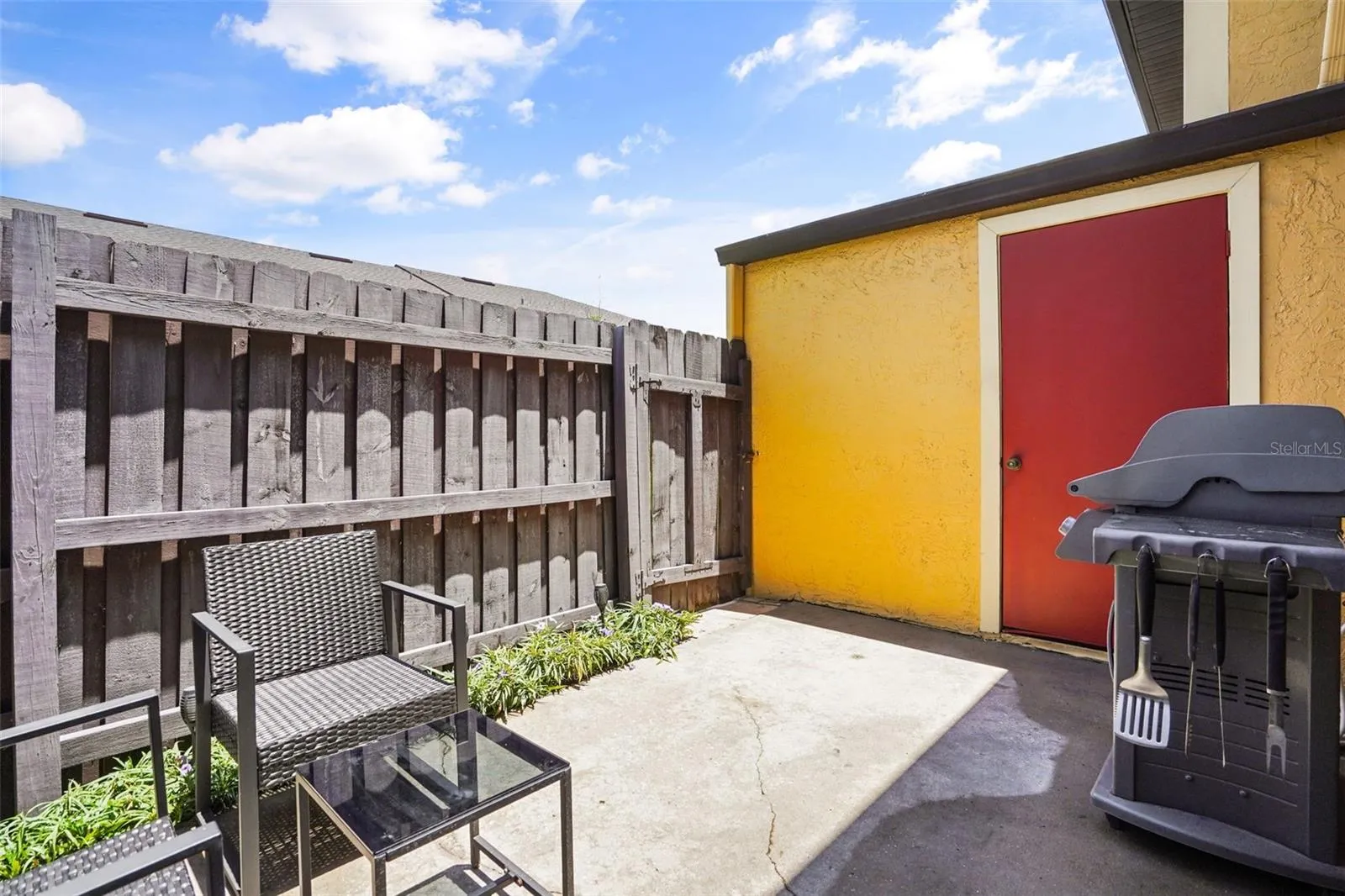 Private Rear Patio with Storage Room