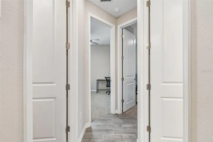 Hallway To Bedrooms Three, Four & Laundry Room