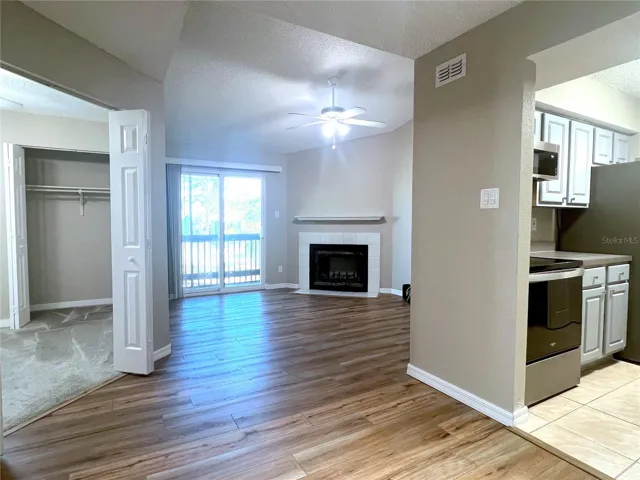 View from Dining Room into Great Room - Kitchen to Right