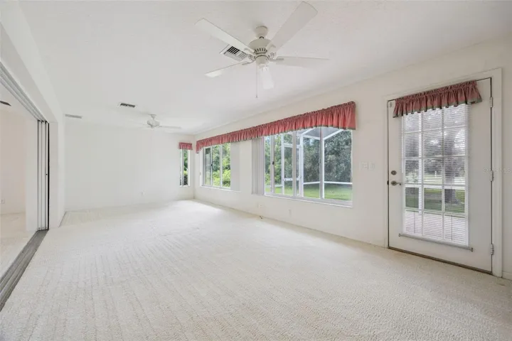 family room with direct access to the backyard and screen enclosed lanai