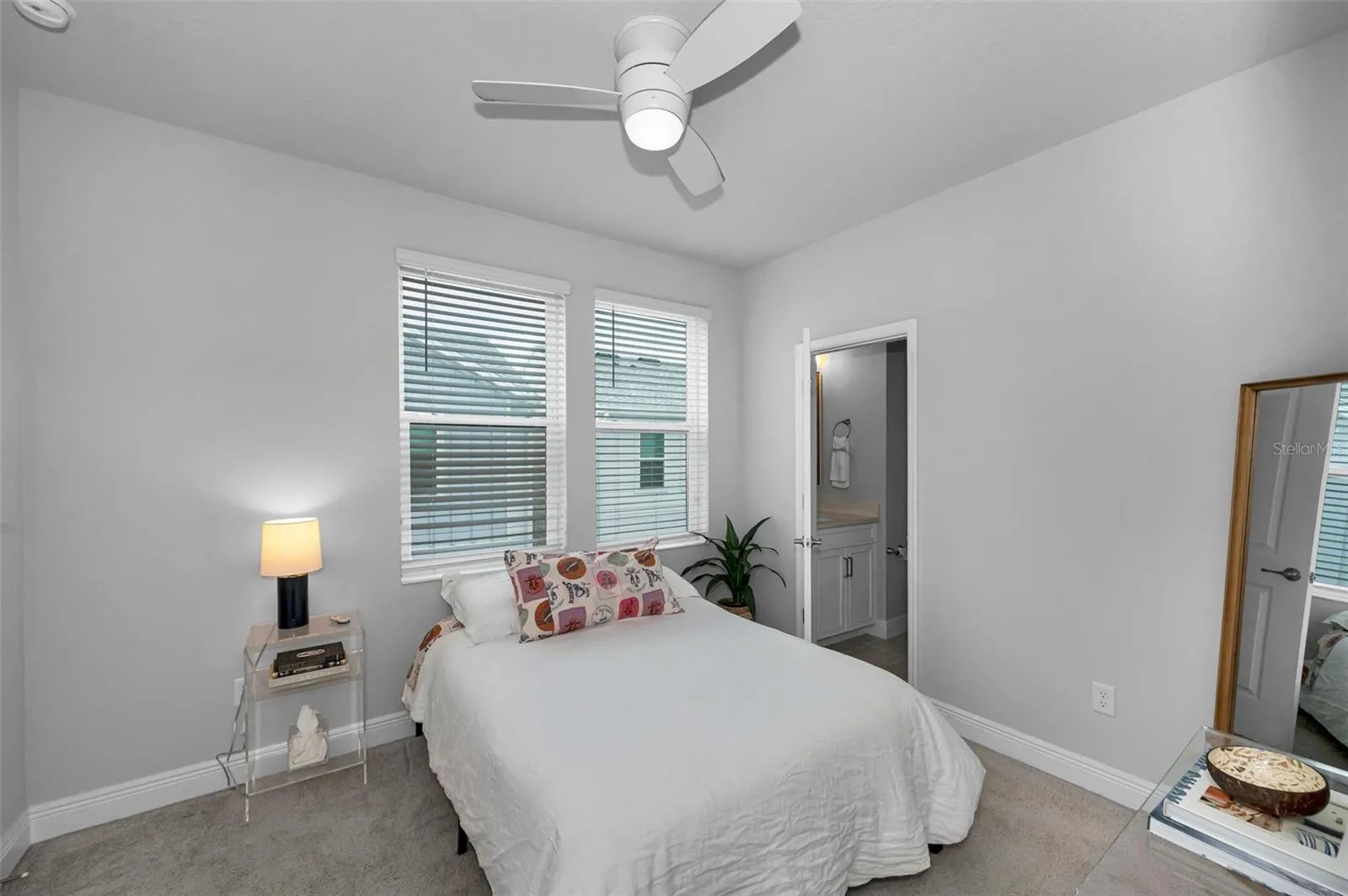 Bedroom 2 with custom closet and private bathroom