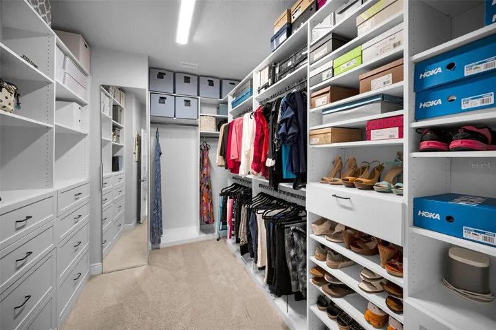 Large primary bedroom custom walk in closet