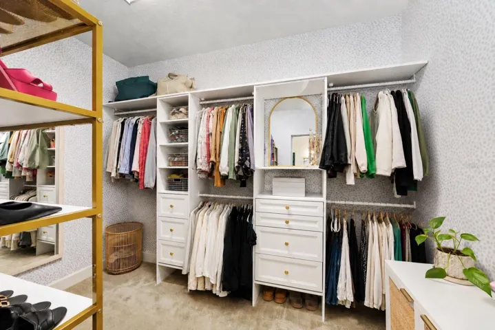 1 of 2 Primary bedroom walk in closets