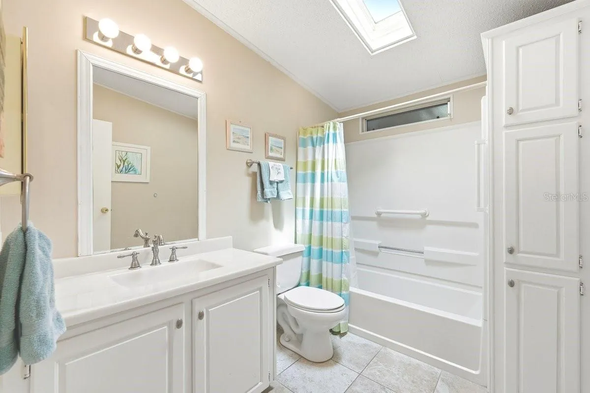 Hall Bath with Tub/Shower Combination. Built in Linen Closet. Upgraded Brushed Nickel Faucet.