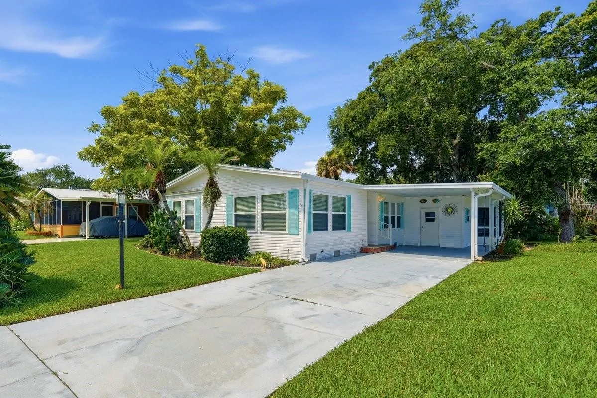 Front of Home showing Carport, Storage. Notice the long driveway