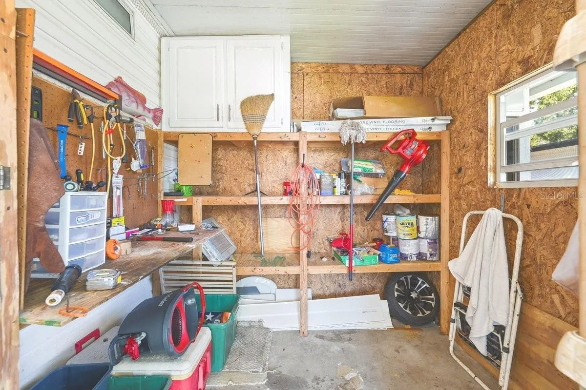 Carport Storage Room; perfect for tools and hobbies.