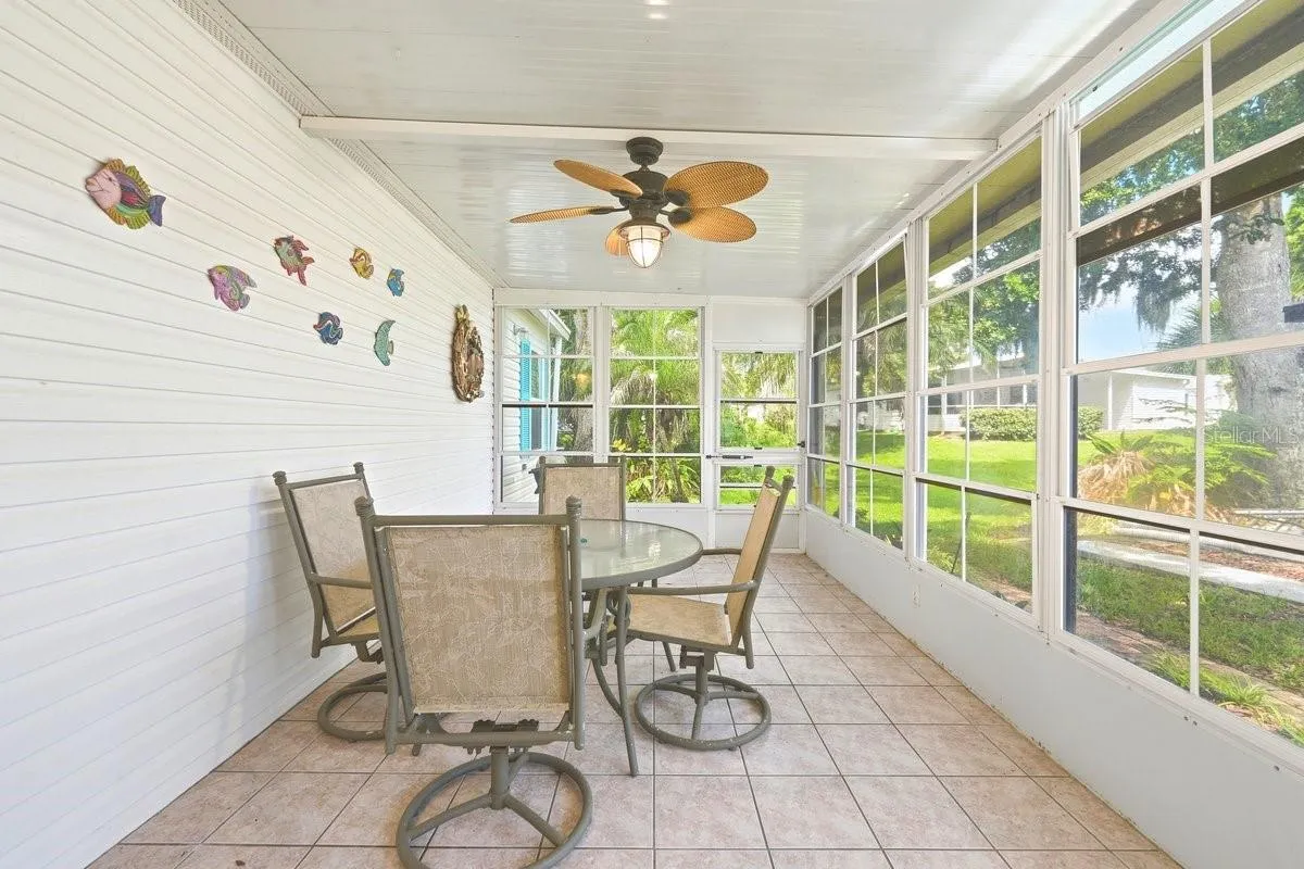 Two Doors leading outside either to front of house or to back of home. This view is showing back of home. Lots of Natural Light on this great Florida Room