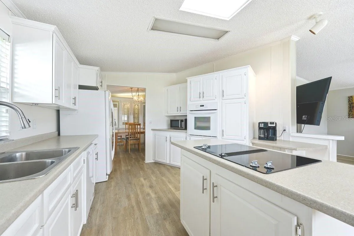 Fantastic kitchen for the cook at heart. Loads of cabinet space. Wall oven &amp; Cooktop. Skylight.
