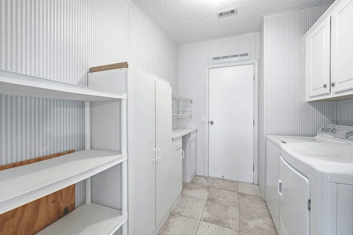 INDOOR Laundry Room. Look how spacious with lots of extra space for all your storage needs.
