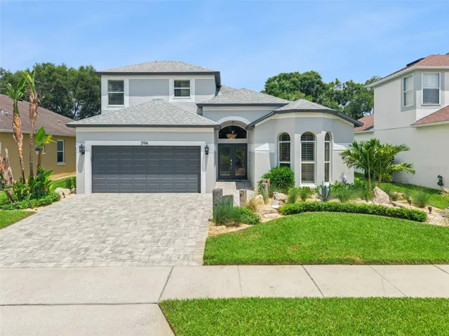 Front exposure with a gorgeous paver-driveway