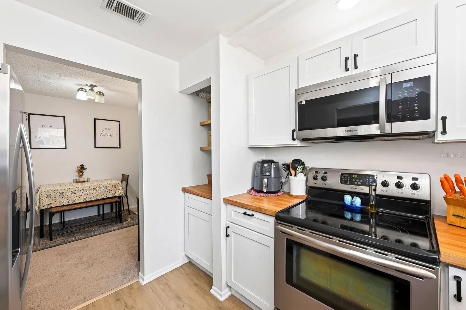 Kitchen has a built-in coffee nook.