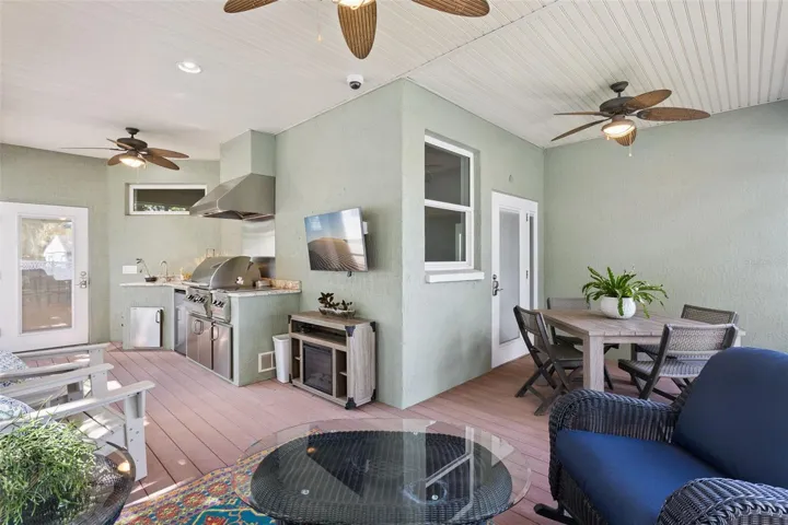 Amazing Screened back porch with built in Grill area, living area and dining room
