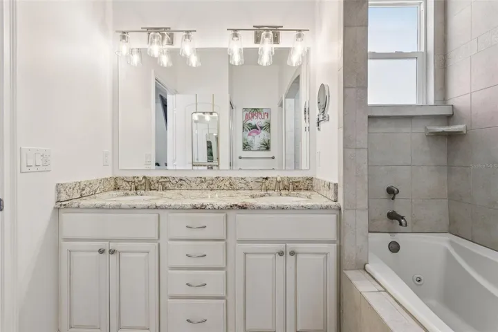 Primary Ensuite Bathroom with double sinks and garden tub.