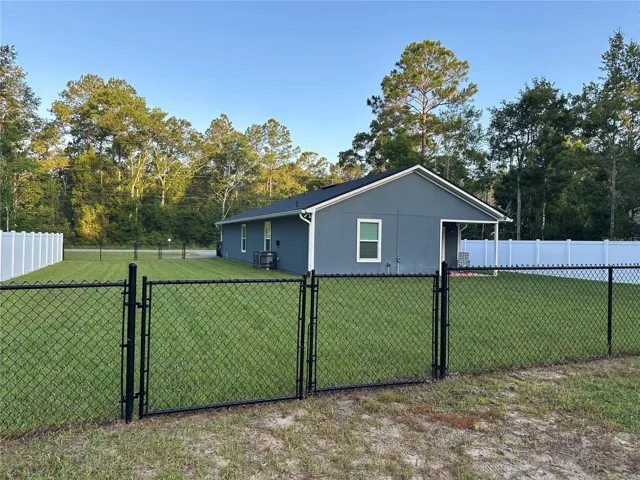 Fenced yard with new sod