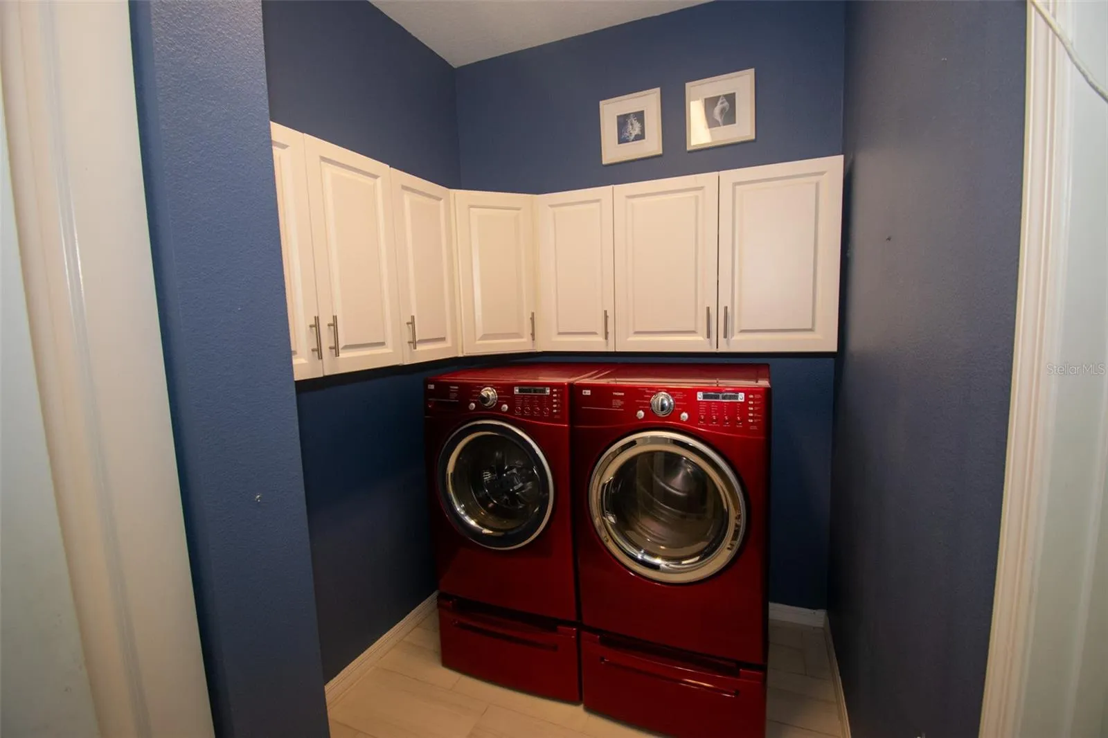 Located near the center of the house is your indoor laundry room. Washer and dryer stay with the home and have selves for detergent storage underneath.