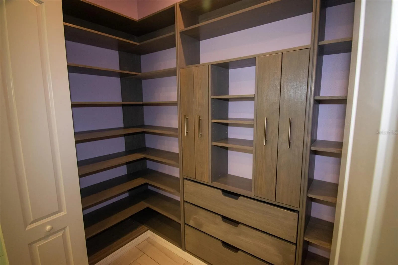 Walk-in pantry with room for all your extra big pots.