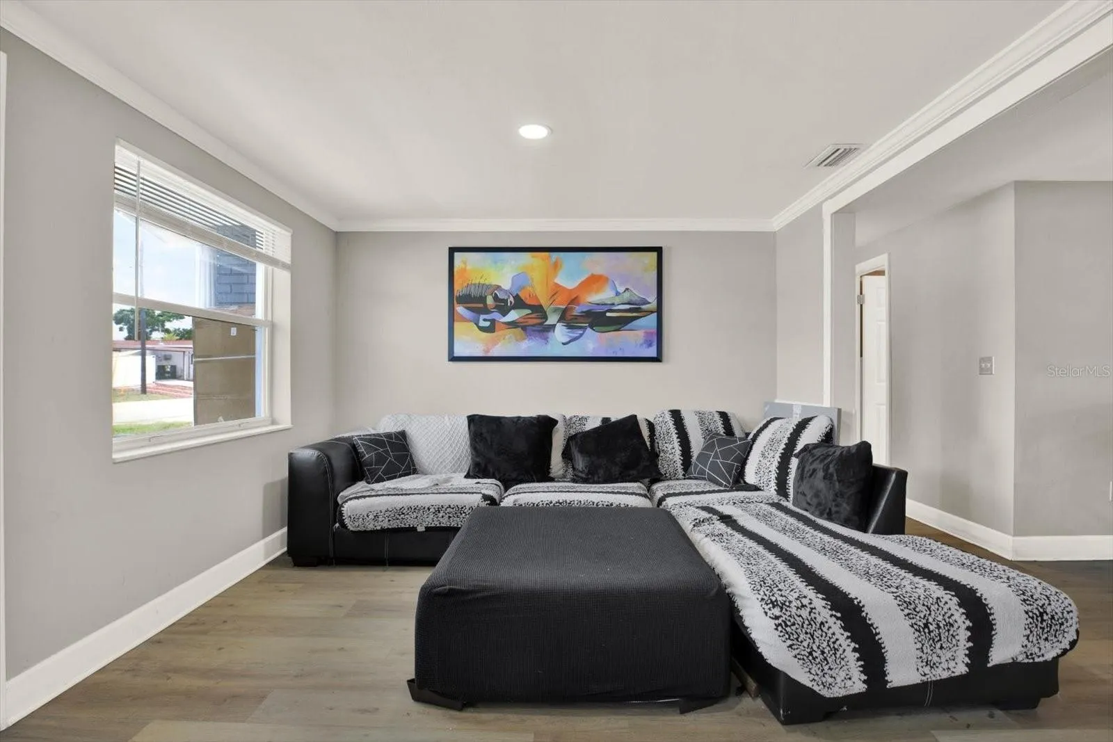 living room/wide hallway to bedrooms and a bathroom