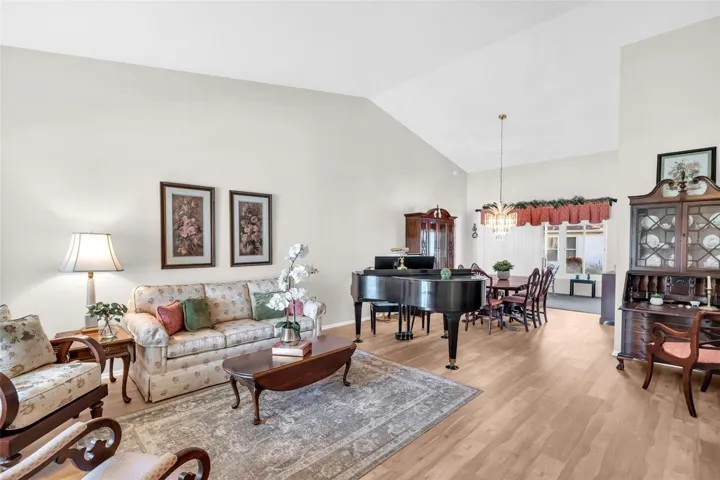 Soaring vaulted ceilings &amp; luxury vinyl plank flooring upon entry~