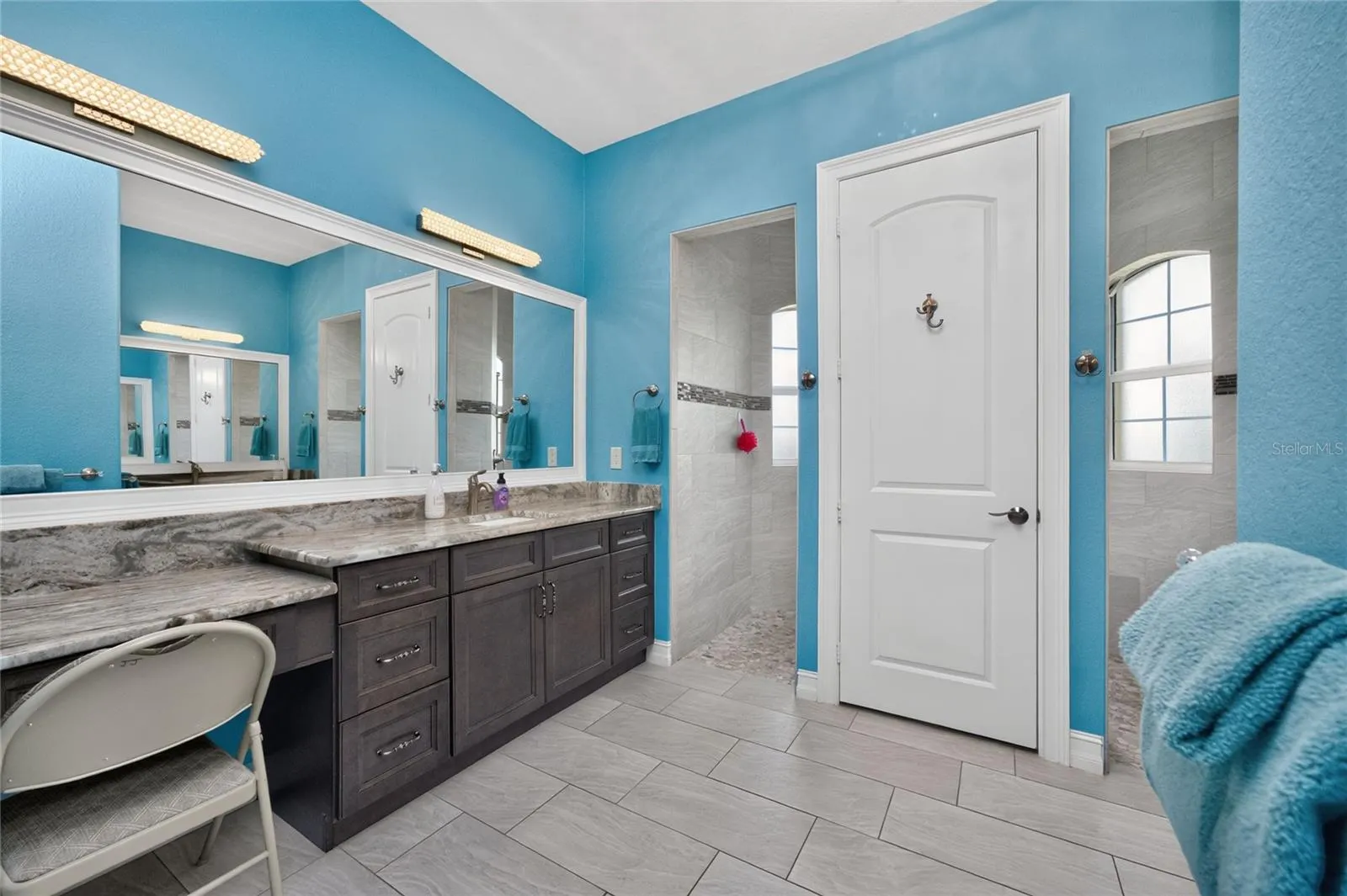 Wood vanity with granite counters