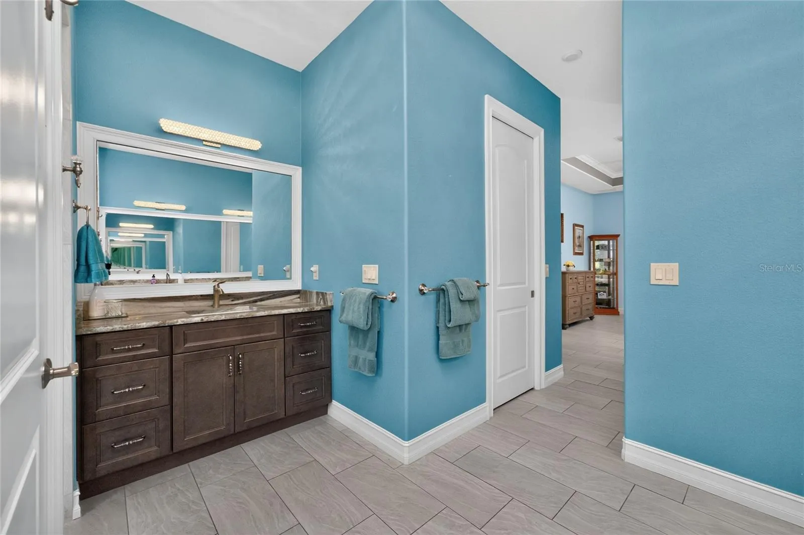 2nd wood vanity in primary ensuite