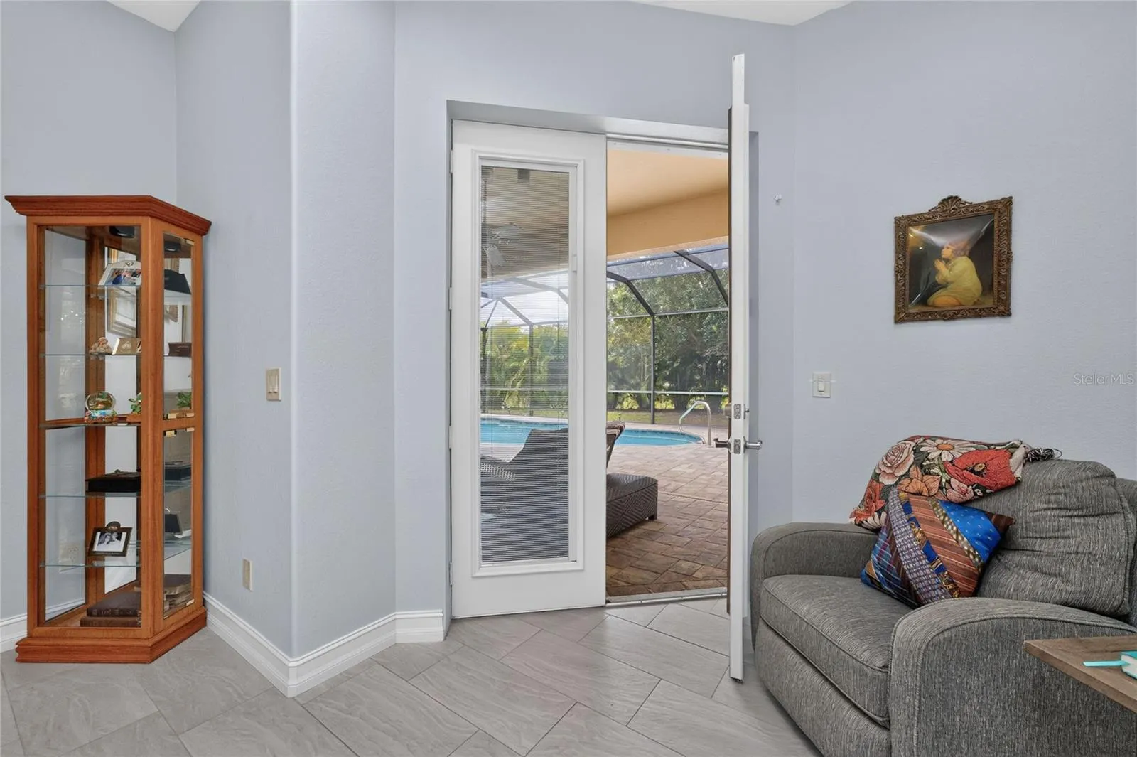 French doors to the lanai and pool