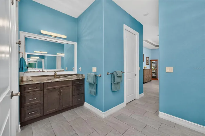 2nd wood vanity in primary ensuite