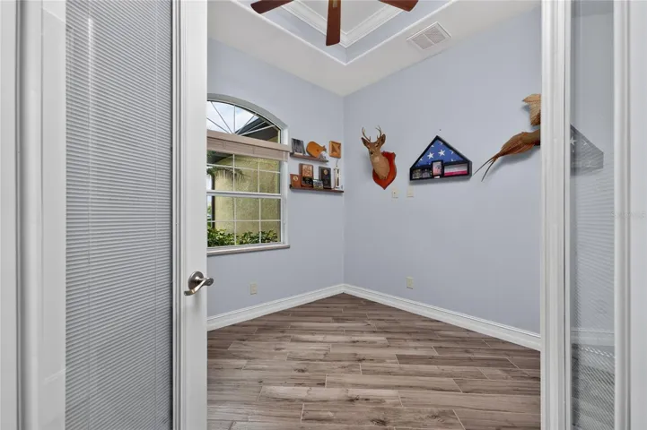 Office with tray ceiling is in the front of the home on the left when you enter
