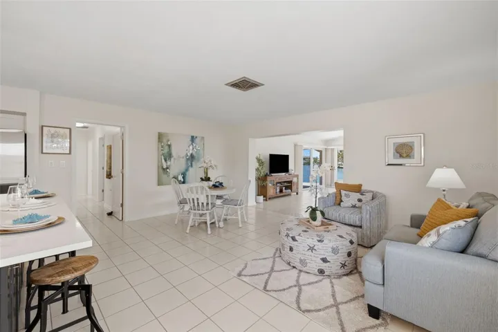 Enter into the kitchen, den and dining areas