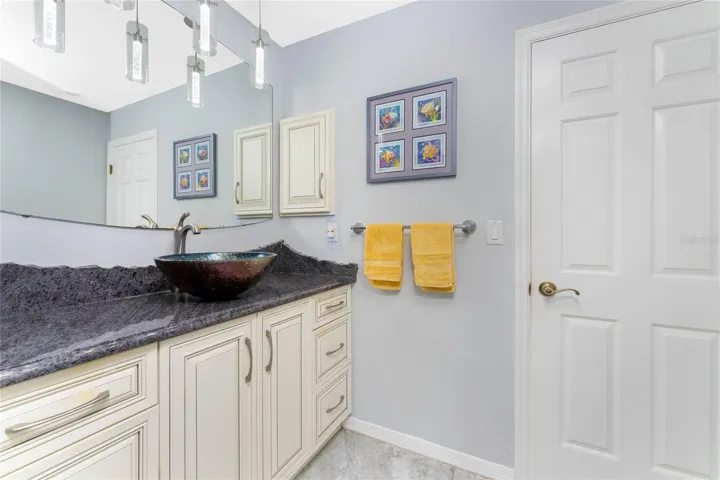 This custom-designed bathroom, where serene