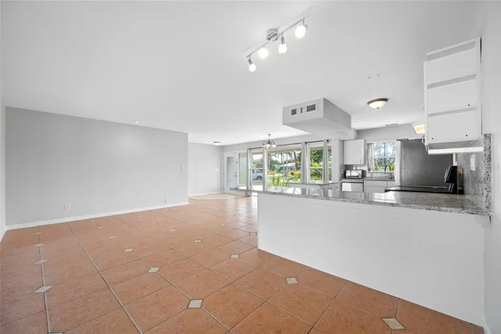 Kitchen and room for a table