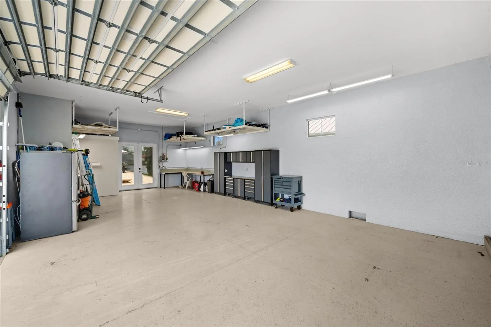Soaring ceilings in the mancave give plenty of space to add lifts