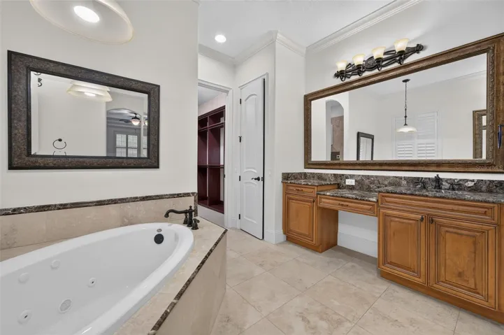 Primary Bathroom featuring dual vanities