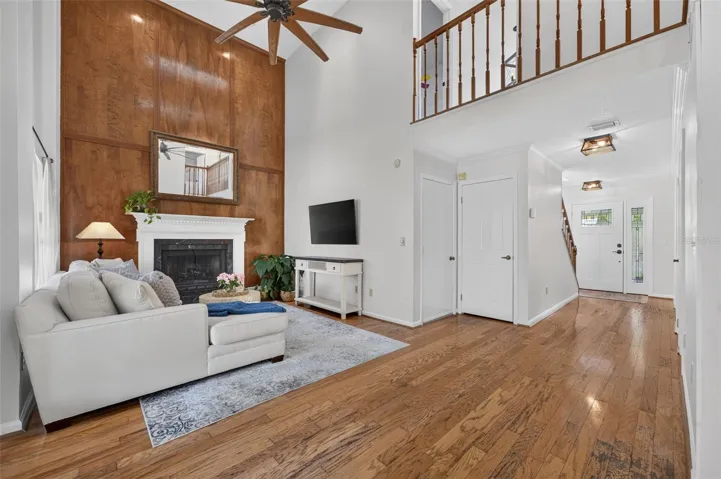 Two Story Family Room featuring a wood-burning fireplace