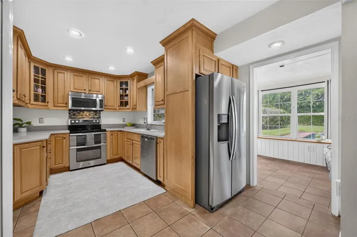 The sunroom is located just off of the kitchen