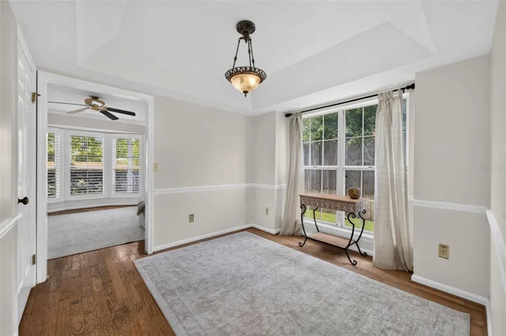 Dining room featuring a tray ceiling