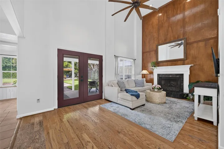 French doors leading out to the covered lanai & beautiful backyard
