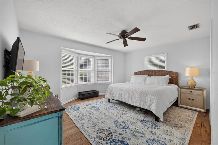Primary Bedroom with a charming bay window