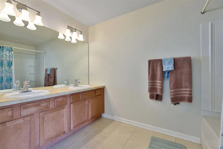Primary bath with dual sinks, tub with shower