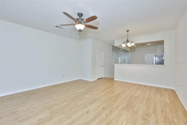 Great Room with Ceiling fan and light fixture for dining area