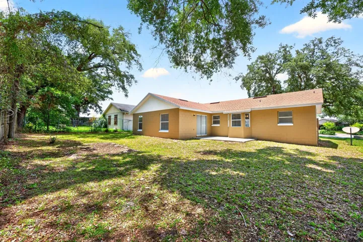 Large backyard, mature trees.