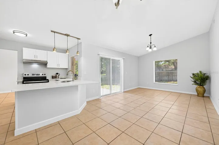 Light filled family room off the kitchen with sliding glass door access to the patio and backyard.