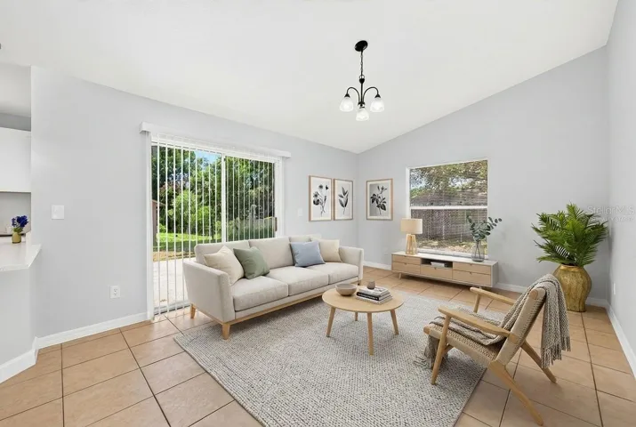Light filled family room off the kitchen with sliding glass door access to the patio and backyard. Virtually Staged.