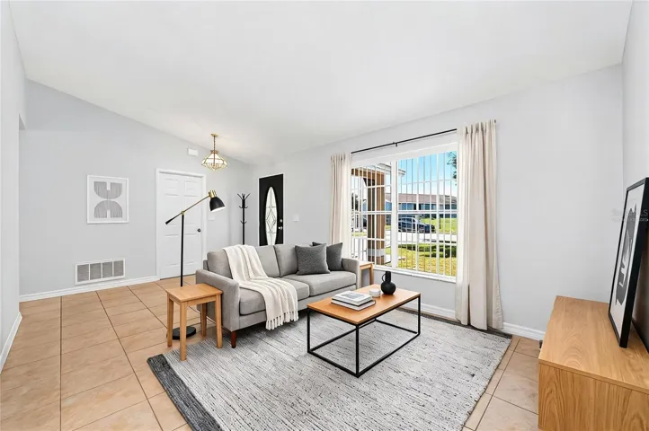 Versatile formal living and dining spaces at the front of the home. Virtually Staged.
